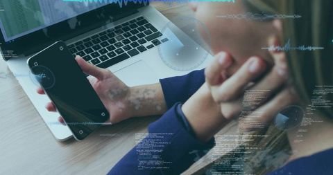 Modern Businesswoman Analyzing Data with Smartphone and Laptop