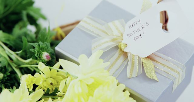 Mother’s Day Gift with Yellow Flowers and Message Card - Download Free Stock Images Pikwizard.com