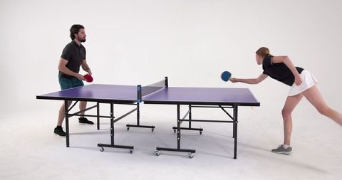 Dynamic Ping Pong Match Featuring Skilled Athletes in Action