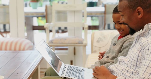 Father and Son Bonding Over Laptop - Download Free Stock Images Pikwizard.com