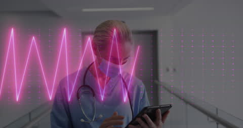 Doctor Analyzing Data with Heart Rate Monitor Overlay Technology