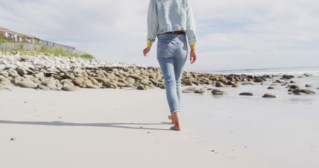 Woman Walking on Beach, Relaxed Seaside Stroll on Sunny Day - Download Free Stock Images Pikwizard.com