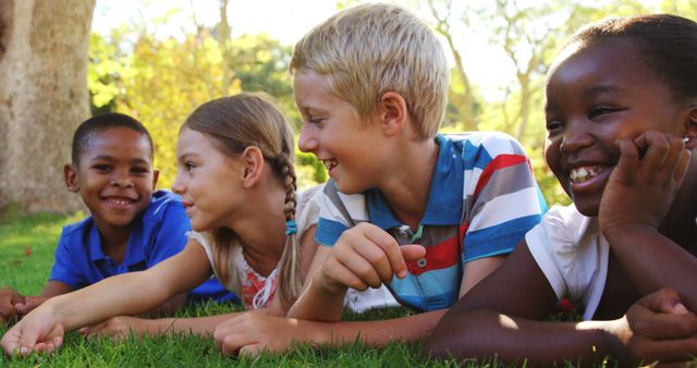 Diverse Group of Children Lying on Grass in Park Enjoying Outdoors - Download Free Stock Images Pikwizard.com