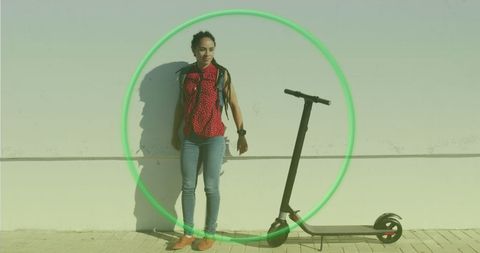 African american woman with eco-friendly electric scooter street scene