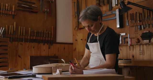 Senior woodworker creating handcrafted goods at workshop workstation - Download Free Stock Images Pikwizard.com