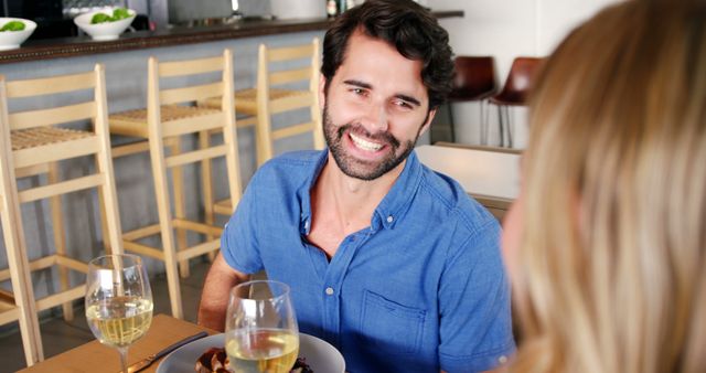 Smiling Man Having Dinner Date in Cozy Restaurant - Download Free Stock Images Pikwizard.com