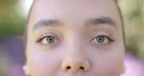 Close-Up Beauty: Captivating Green Eyes Highlight Natural Makeup