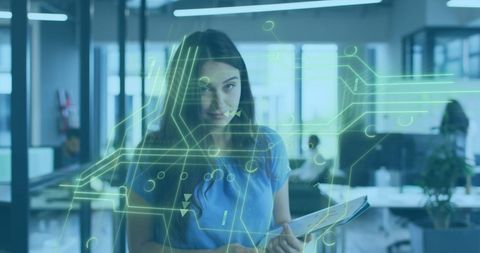 Businesswoman Engaging with Futuristic Circuit Board Projection - Download Free Stock Images Pikwizard.com