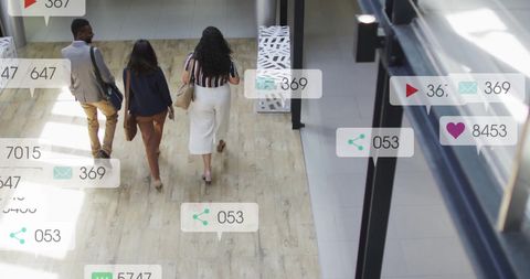 Coworkers Walking with Social Media Notifications Overlay