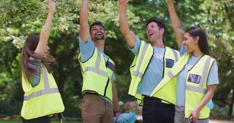 Eco Volunteers Celebrating Forest Cleanup Success