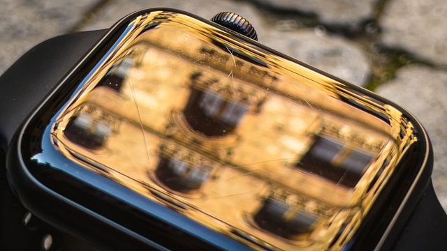 Cracked smartwatch screen reflecting urban building macro closeup of damaged wearable