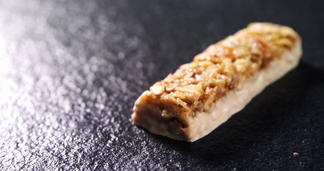 Close-Up of Granola Energy Bar on Dark Surface - Download Free Stock Images Pikwizard.com