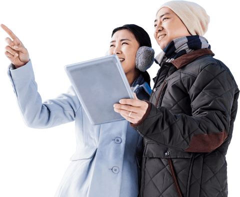 couple in winter clothing pointing and holding tablet on transparent background - Download Free Stock Videos Pikwizard.com