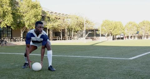 Athlete prepares for rugby game on sunny day