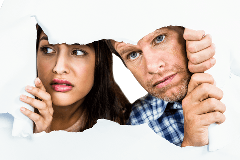 Transparent Paper Torn by Cautious Couple Peeking Through