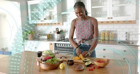 Woman Chopping Vegetables in Modern Rustic Kitchen Setting