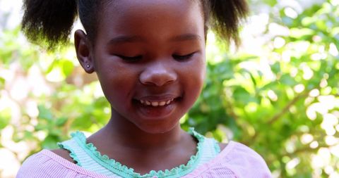 Young Girl Engaging with Smartphone Outdoors