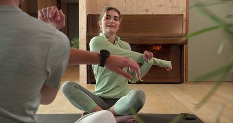 Workout Partners Stretching at Home Studio Near Piano