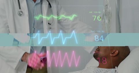 Doctor Reviewing Digital Vitals with Patient in Hospital Bed
