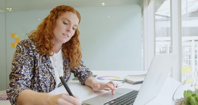 Woman Designing with Stylus Pen in Modern Office - Download Free Stock Images Pikwizard.com