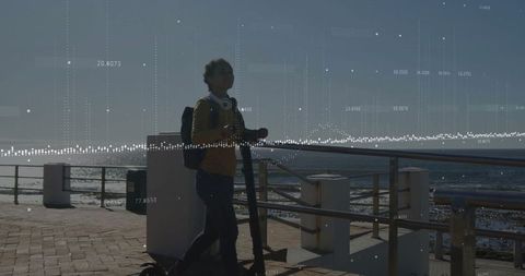 Child Scooting by Coastal Path with Futuristic Data Overlay