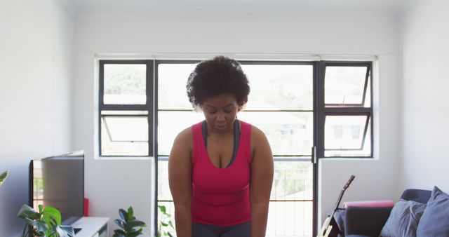 Focused Woman Practicing Yoga at Home near Large Windows - Download Free Stock Images Pikwizard.com