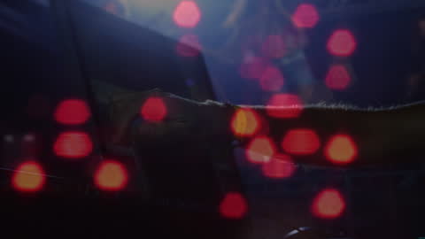 Blurred Bokeh Lights Drift Over Pianist on Stage