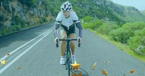 Cyclist enjoying scenic mountain road ride