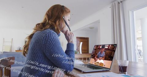 Professional Woman Engaged in Virtual Meeting from Home Office