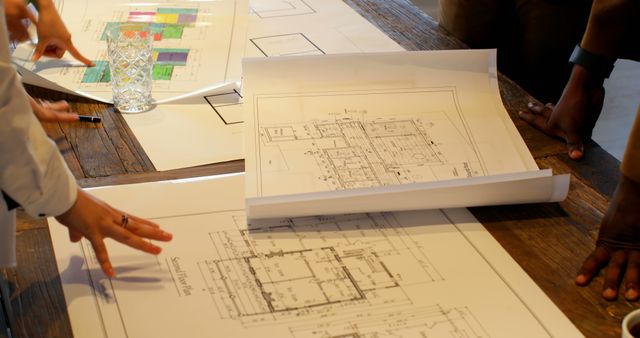 Architects Collaborating on Building Plans - Download Free Stock Images Pikwizard.com