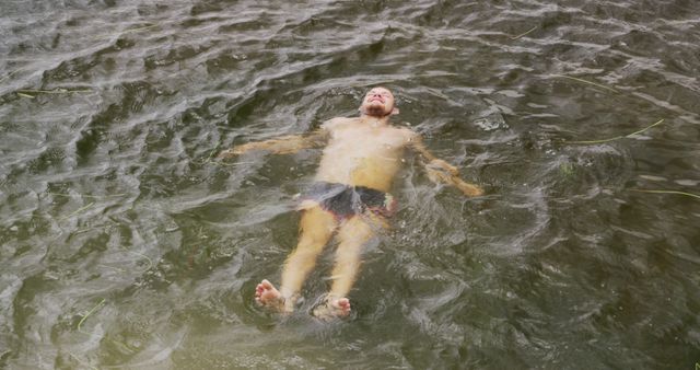Man Relaxing and Floating in River Water - Download Free Stock Images Pikwizard.com