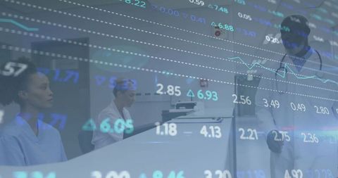 Clinicians reviewing patient data with digital charts overlay for healthcare analytics