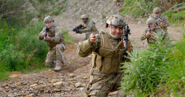 Military Unit Navigating Through Forested Terrain in Combat Gear - Download Free Stock Images Pikwizard.com