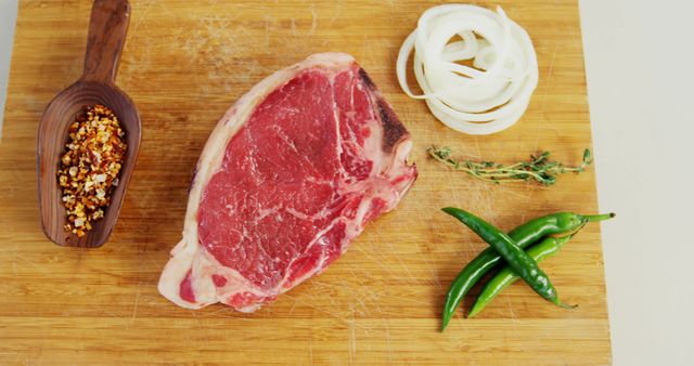 Fresh Raw Steak with Spices and Vegetables on Wooden Cutting Board - Download Free Stock Images Pikwizard.com