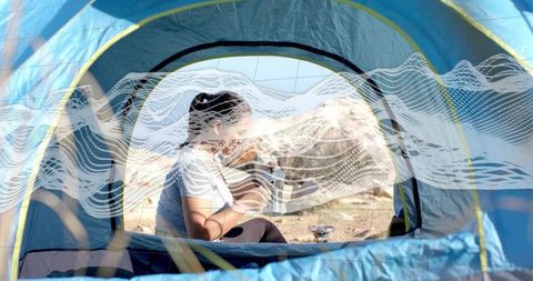 Camper Preparing Hot Drink Inside Tent With Scenic View