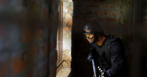 Soldier Holding Rifle Looking Through Window During Military Exercise - Download Free Stock Images Pikwizard.com