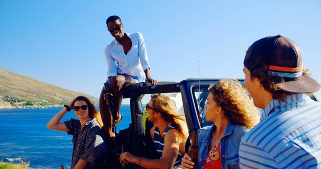 Diverse group of friends enjoying a carefree summer road trip by the ocean, smiling and relaxing. Perfect for content related to vacations, adventure, freedom, friendship, and leisure activities. Ideal for travel blogs, tourism ads, and promotional material highlighting togetherness and enjoyment.