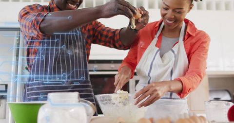 Cheerful Couple Cooking Together in Home Kitchen