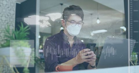 Businessman Analyzing Data on Phone and Laptop with Financial Graphics