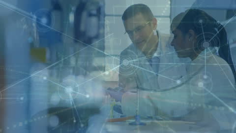 Multiracial Scientists Collaborating with Digital Network in Laboratory