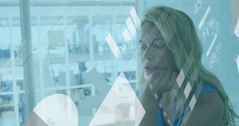 Businesswoman Analyzing Digital Data Overlay in Office