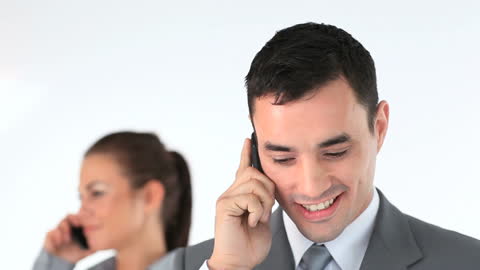 Business Professionals Engaging in Telephone Conversations