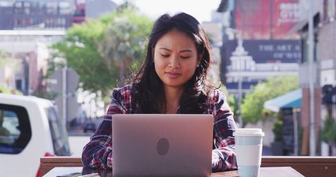 busy asian businesswoman using laptop outdoors in urban area - Download Free Stock Images Pikwizard.com