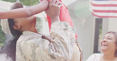 African American Soldier Celebrating Reunion with Family