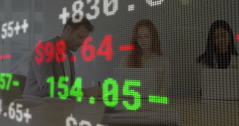 Stock Market Data with Diverse Business Team Analyzing in Office