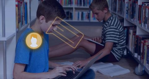 Teen boys typing on laptop while peer reading books in library aisle with AR overlay