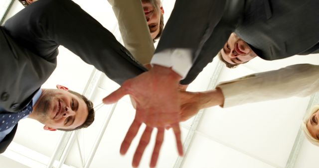 Team of Business Professionals Showing Unity with Low-Angle View - Download Free Stock Images Pikwizard.com