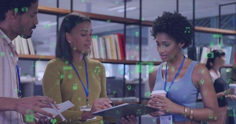 Diverse business team intently collaborating in modern office