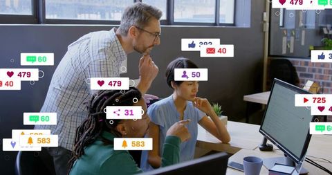 Marketing team monitoring surge of social notifications while adjusting campaign strategy