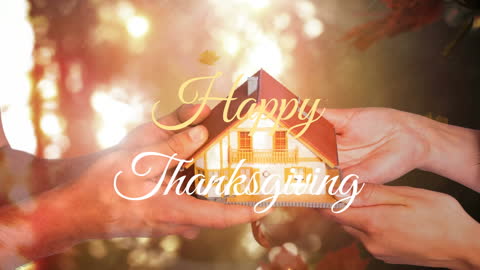 Visual featuring couple holding a small model house with 'Happy Thanksgiving' text overlay. This can be used for promoting Thanksgiving events, holiday greeting cards, or illustrating themes of gratitude and home during festive seasons.